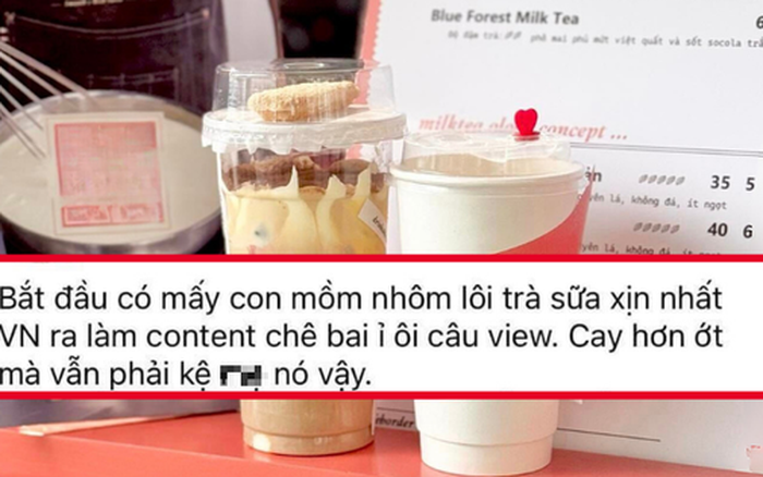 Nội thất ấm cúng của quán Tiệm Trà Lời với bàn ghế gỗ và cây xanh